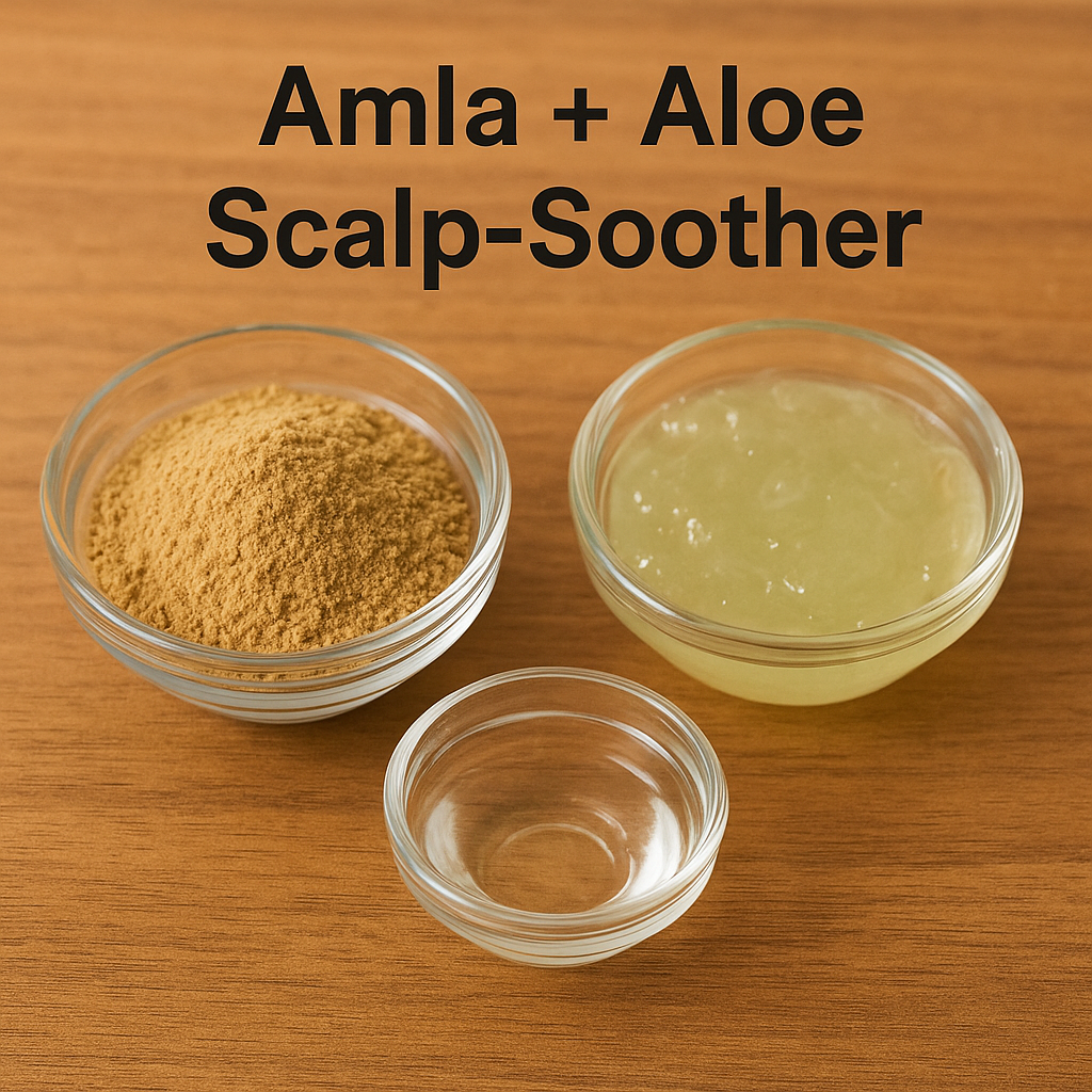 Three glass bowls containing amla powder, aloe vera gel, and coconut oil arranged on a wooden surface.