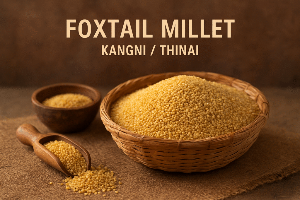 “Close-up of foxtail millet grains in a wicker basket with a wooden scoop and bowl, showcasing Kangni / Thinai as a nutritious Ayurvedic grain.”