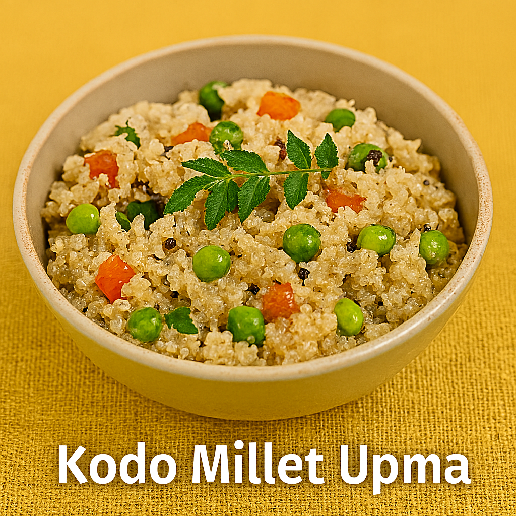 A bowl of Kodo Millet Upma garnished with curry leaves, featuring beige millet grains mixed with green peas, red tomato bits, and black mustard seeds, set against a mustard-yellow fabric background.