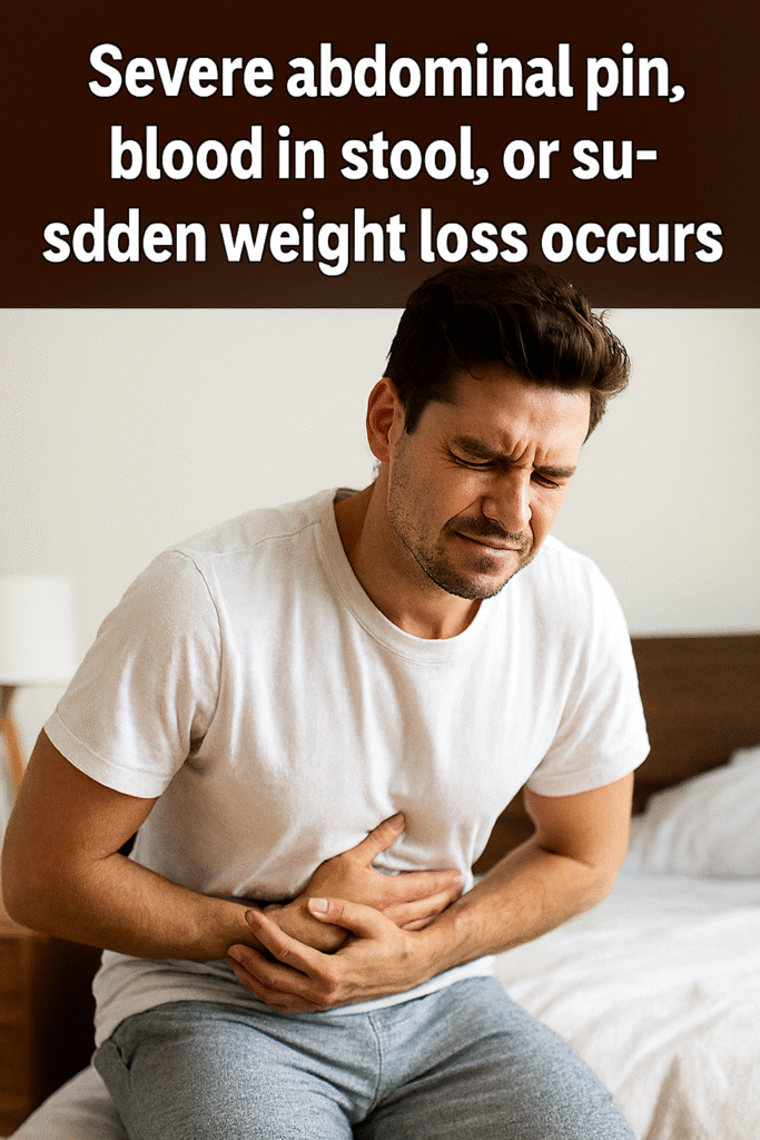 A young man sitting on the edge of a bed, clutching his lower abdomen with a pained expression. He wears a white T-shirt and gray sweatpants. Text overlay warns of severe abdominal pain, blood in stool, or sudden weight loss.